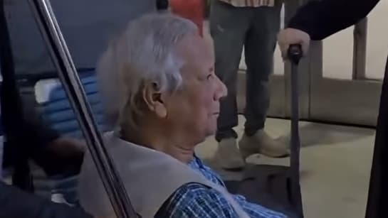 Image from source article: Yunus heckled at New York's JFK airport